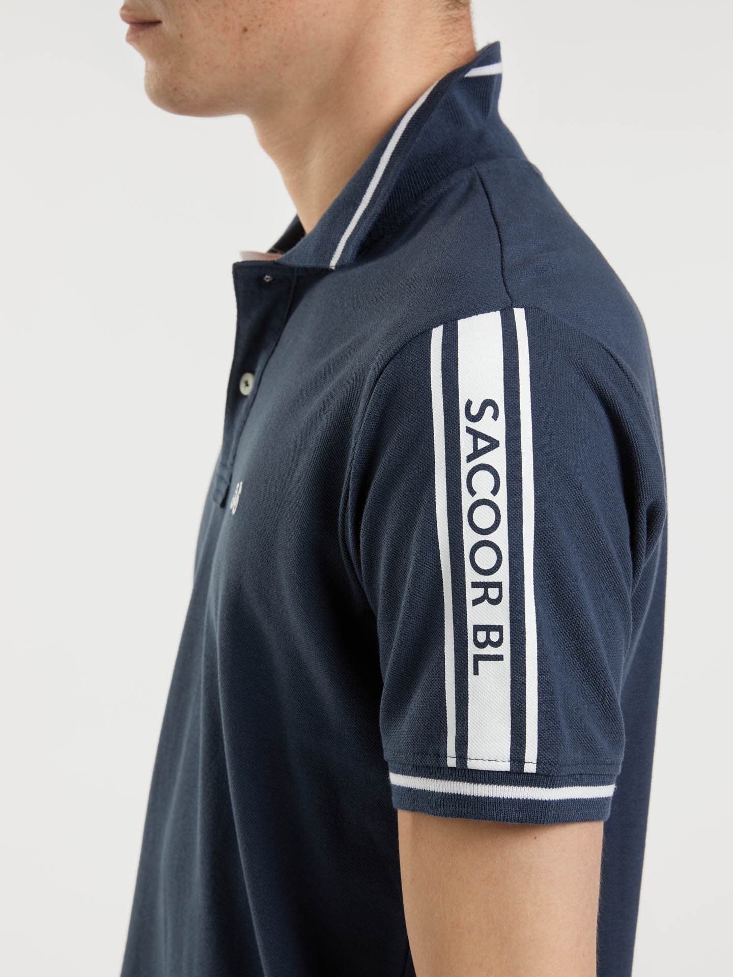 The printed sleeve polo shirt by SACOOR BLUE